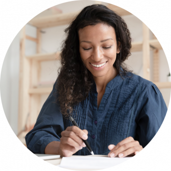 woman filling out paperwork,smiling
